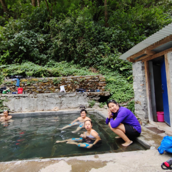 The trekkers enjoy the Jhinu hot spring after trekking to the Annapurna base camp.